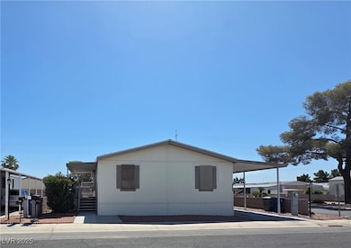 View of property exterior with a gate