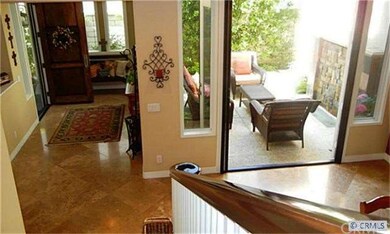 Formal front entry.  Courtyard patio.
