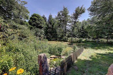 Organic herb garden, view toward pasture.