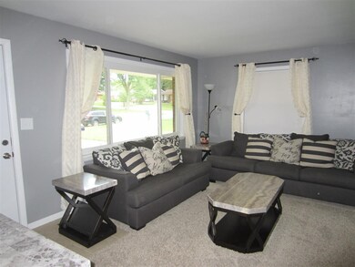 The Living Room has a large picture window that pr
