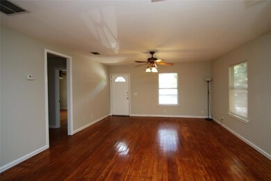 Spare room with hardwood / wood-style floors and 
