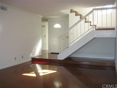 Sunlit living room and beautiful wood floors.....