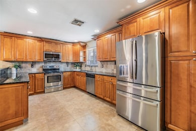 Stainless Steel Appliances, Granite Counter Tops and inset lighting