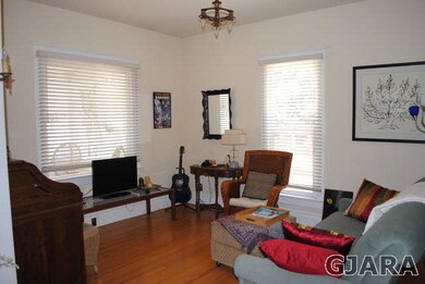 Sitting room one with built-in original mirror and