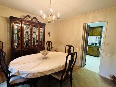 Dining area featuring a notable chandelier and cro