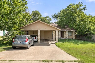 View of front of property with concrete driveway,