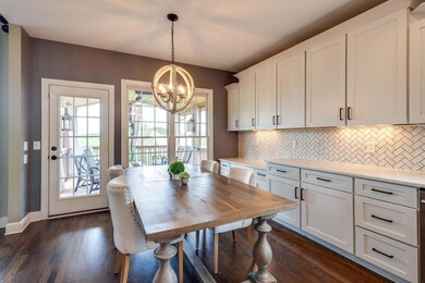 The eat-in kitchen is large enough for a big farmhouse table! Right off the kitchen is the covered deck. 
