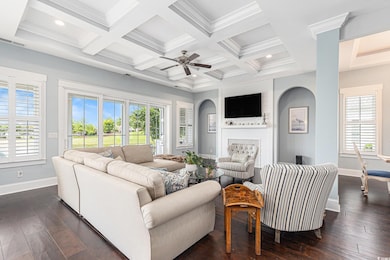 Living area with baseboards, plenty of natural lig