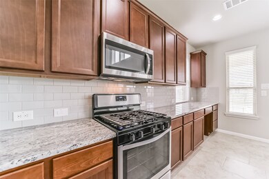 Gas stove with beautiful cabinets, barely touched.