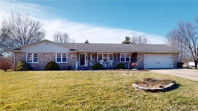 Large front yard w/ double car garage.