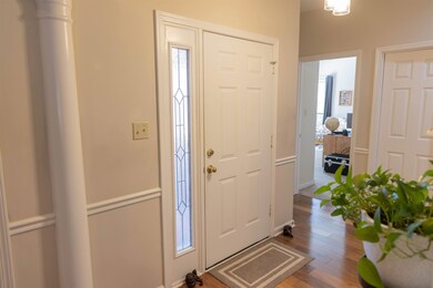 Entrance foyer with dark wood finished floors
