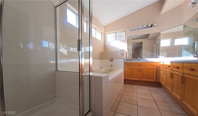 Full bathroom featuring lofted ceiling, vanity, a