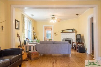 Living room has cozy fireplace.