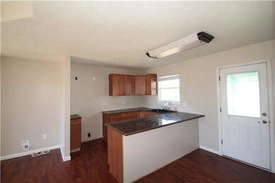 Kitchen with granite tile counters