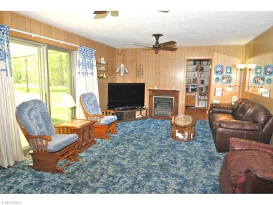 The paneled family room leads to a private office