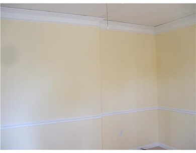Living Room. Note the chair rail & crown molding