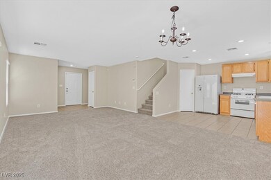 Unfurnished living room with light colored carpet,