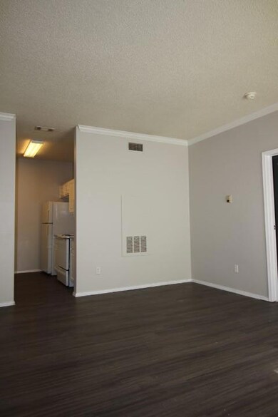 Spare room with visible vents, a textured ceiling