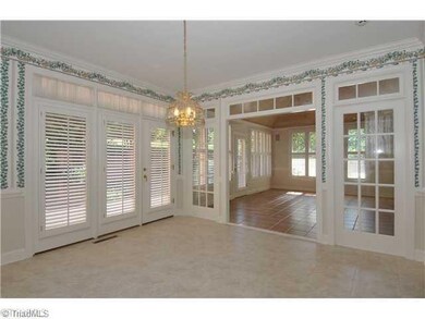 Breakfast. Just beyond the kitchen is an unbelievably large breakfast room - combined with the formal dining room, this house just calls for dinner parties and holiday gatherings. Note the transoms, French door sets and plantation shutters