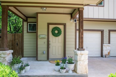 View of exterior entry with concrete driveway and