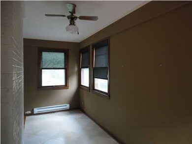 Sun Room off the Living Room with Sliding Doors Le