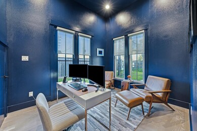 Design worthy navy study with soaring ceilings,  f