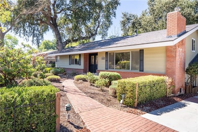 Brick paver pathway gracefully brings you up to the home.