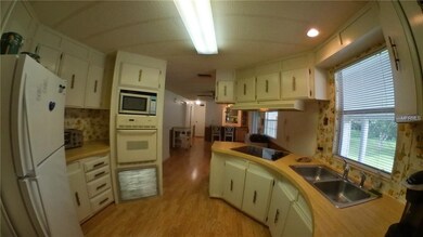 KITCHEN LOOKING TO THE REAR