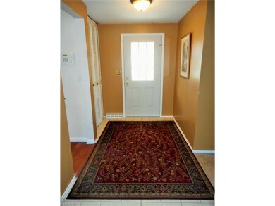 The  ceramic  tile foyer of the home, leads into l