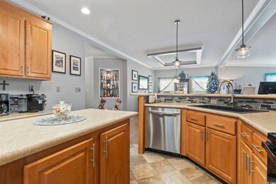 Kitchen with pendant lighting, dishwasher, crown m