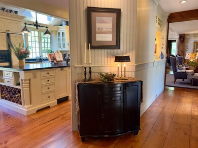 View of wide pine floors upon entering.