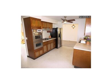 The eat-in kitchen with appliances included opens 