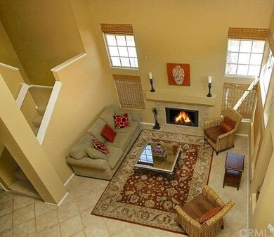 VIEW OF LIVING ROOM FROM 2ND LEVEL HALLWAY