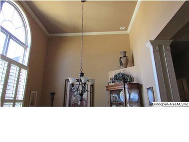 Soaring 14 foot ceiling opens up the dining room. 