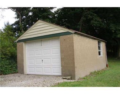 Other. Concrete block garage with newer door and a