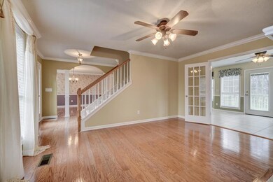 Beautiful hardwood floors and gas fireplace.  French doors  lead from living room into the Den and large Kitchen.