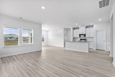 Unfurnished living room featuring light wood-type 