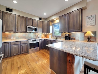 Kitchen featuring appliances with stainless steel