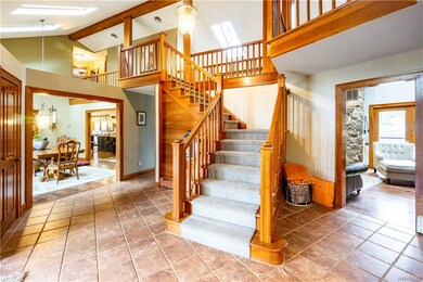 Stunning two story foyer with gorgeous cherry trim