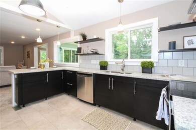 Sleek contrast between light tile flooring and gra
