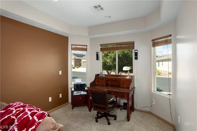 Bedroom featuring baseboards, light colored carpet