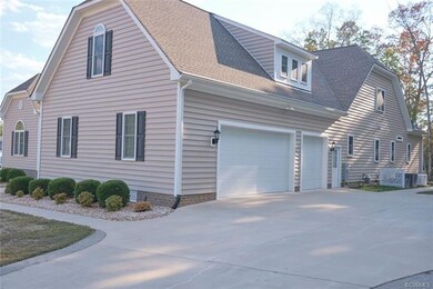Concrete driveway with 3 car garage.