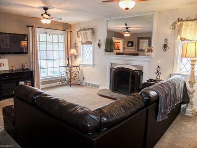 Formal living room with a wood burning fireplace.