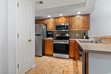 Kitchen featuring stainless steel appliances, ligh