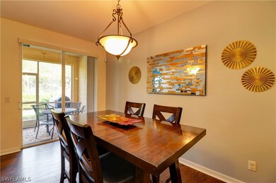 Dining and view of screen enclosed lanai with expa