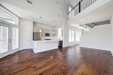 Unfurnished living room with a ceiling fan, visib