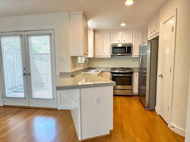 Kitchen with peninsula that serves as a breakfast