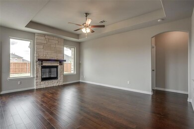 Stunning wood floors with stone fireplace and tray