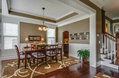 Formal dining room with trey ceiling and lots of w