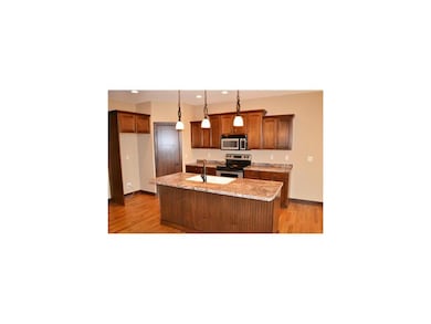 Kitchen. Kitchen with hardwood floors, maple glaze